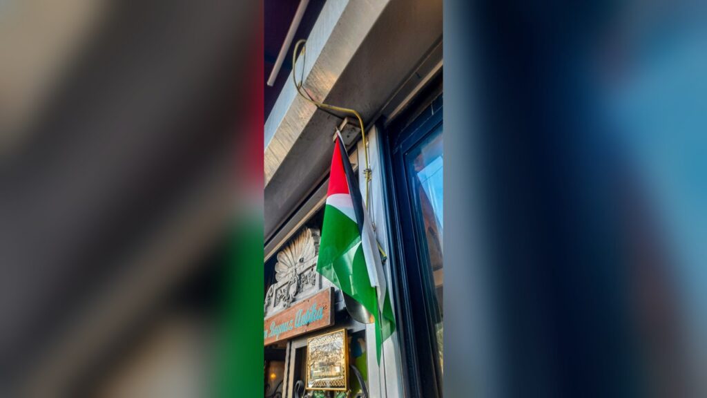 A Palestinian flag that Dr. Feras Hamdan held up to his passenger-side window.