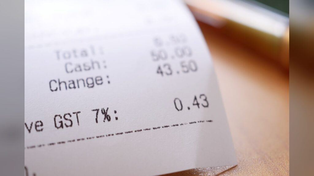 A grocery bill receipt showing prices higher than a year ago.