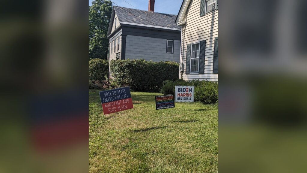 Satirical yard signs with slogans like 'Human Lives Kinda Matter' and 'Science is boring'.