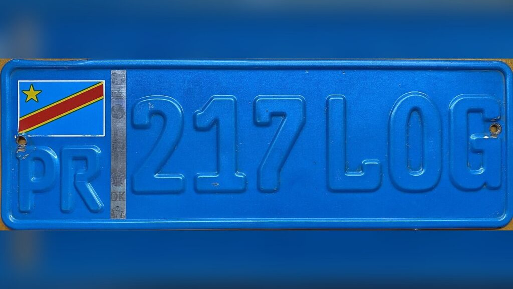 A license plate with one wrong digit, causing a wrongful arrest.