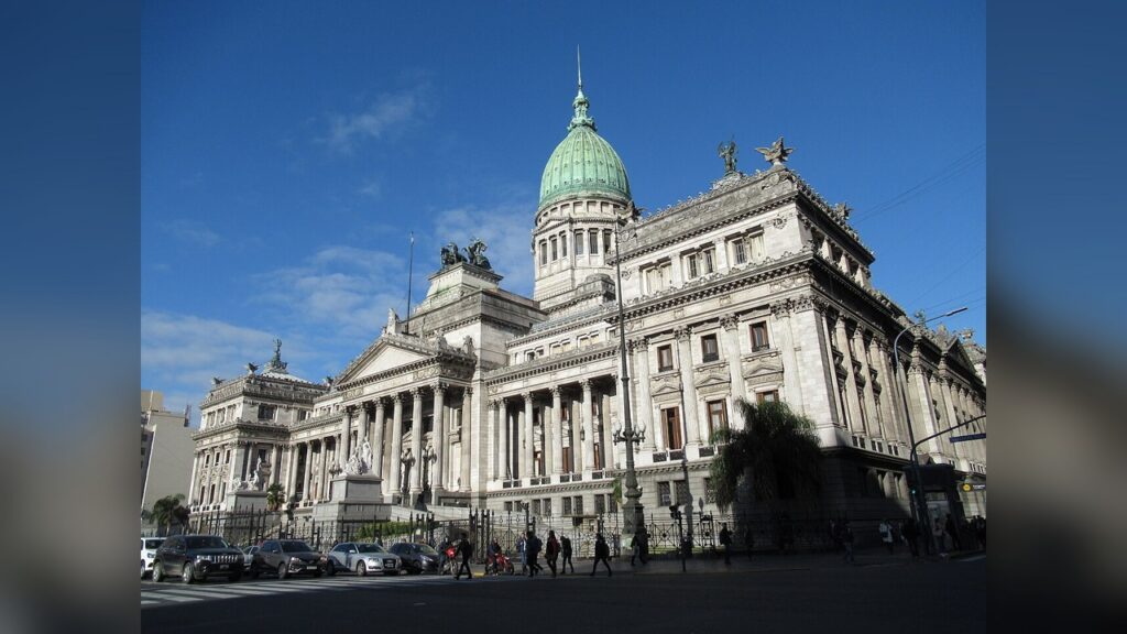 Tear gas drifted over the Congress building during the August 6 protest.