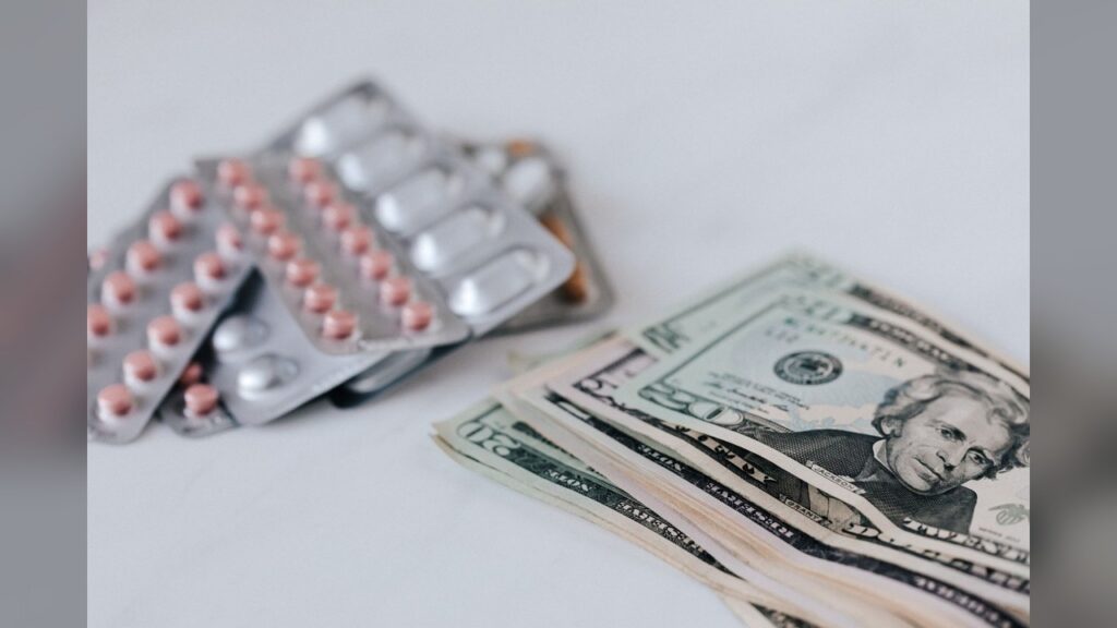 A print-out of a Washington Post headline showing a drop in prescription drug prices.